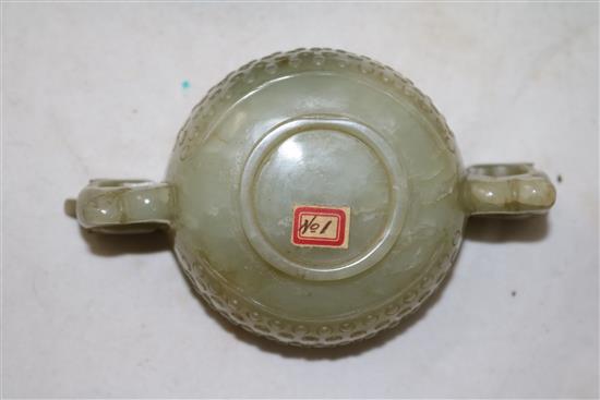 A Chinese celadon jade two handled cup, 17th century, width 12.5cm, rosewood stand